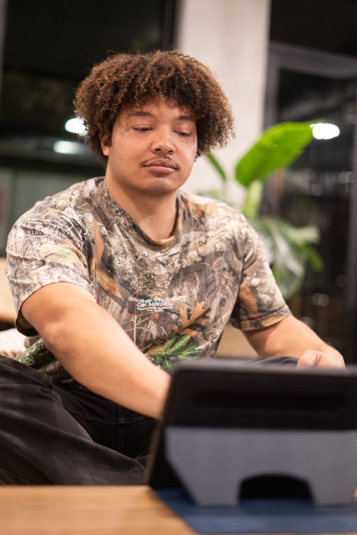 Man Using iPad Tablet