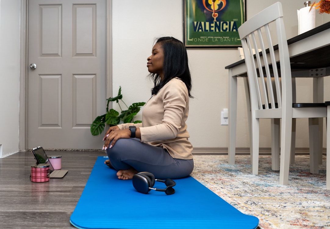 Woman's Guided Yoga with Tablet at Home
