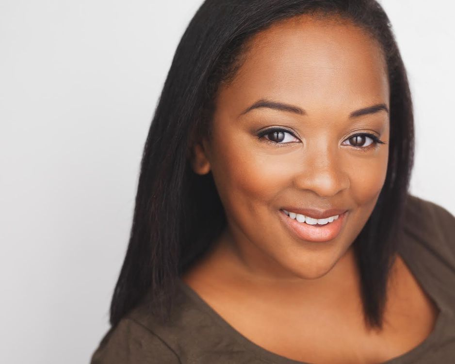 Black woman smiling for camera