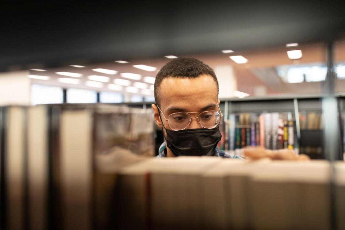 man in library