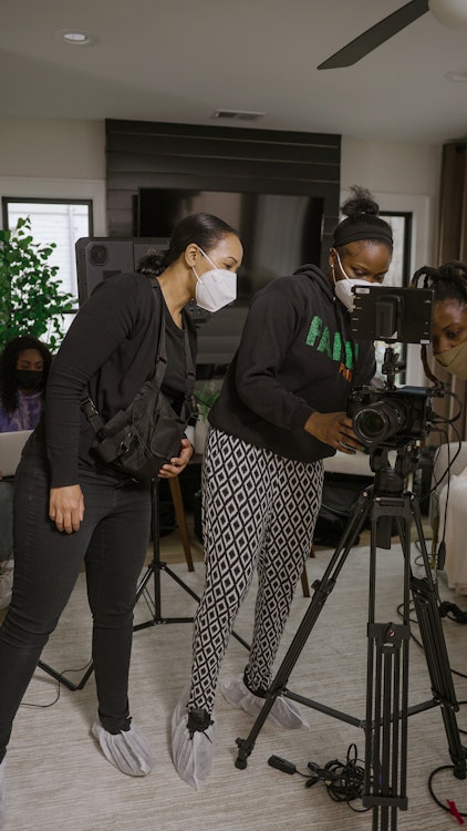 Camerawoman setting up the camera