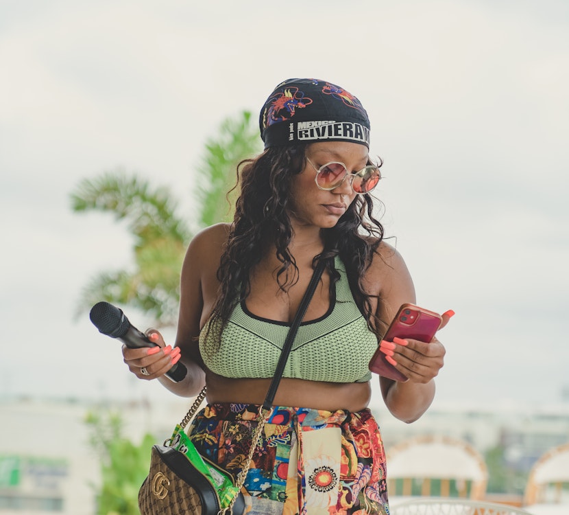 Event Emcee: Woman's Mic and Smartphone